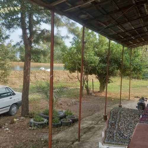 1441متر زمین مسکونی به همراه یک خانه ویلایی با ویو استخر وشالیزار